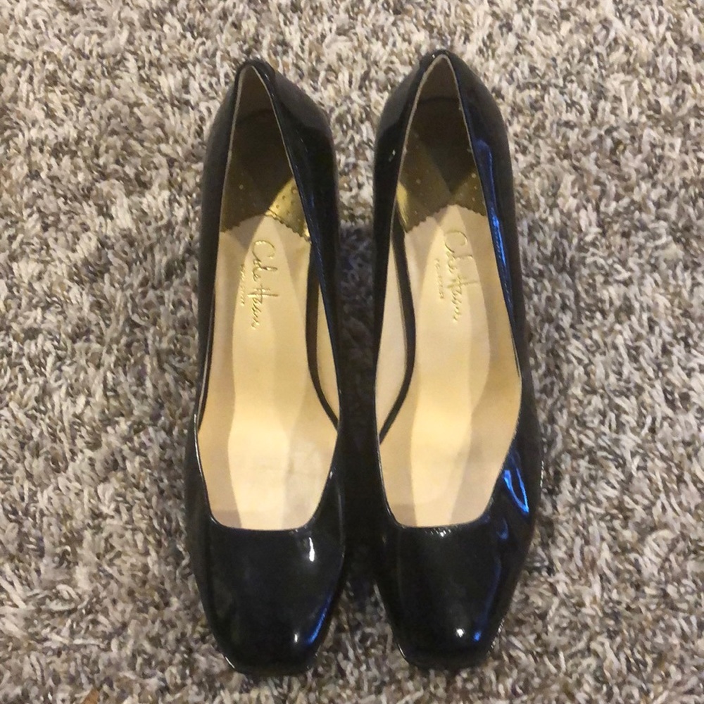 Cole Haan woman’s black patent leather heels.